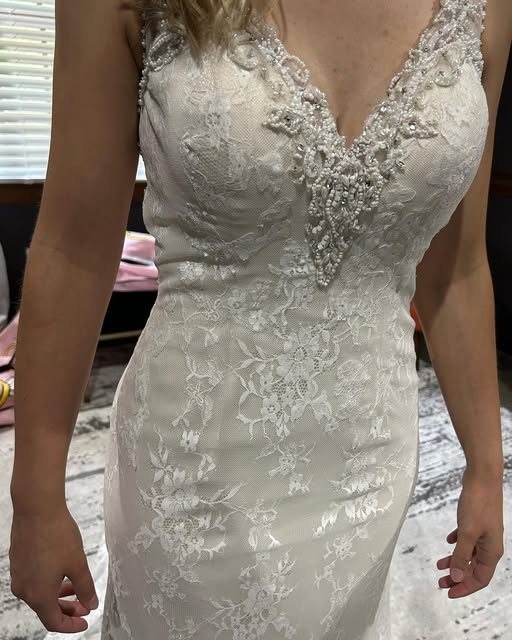 A lace wedding gown fitted at La Bella Tailoring Studio